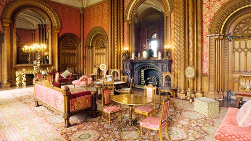 The Drawing Room at Penrhyn Castle, Gwynedd showing the oak chairs and sofa designed by Thomas Hopper and the dazzling silk lampas (brocade) and curtains. This room was the domain of the ladies.